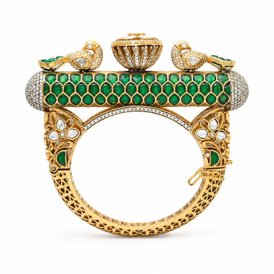 Gold plated 925 silver Mayur Rajsi kada with emerald green stones, Polki detailing, peacock motifs, and intricate handcrafted heritage design.