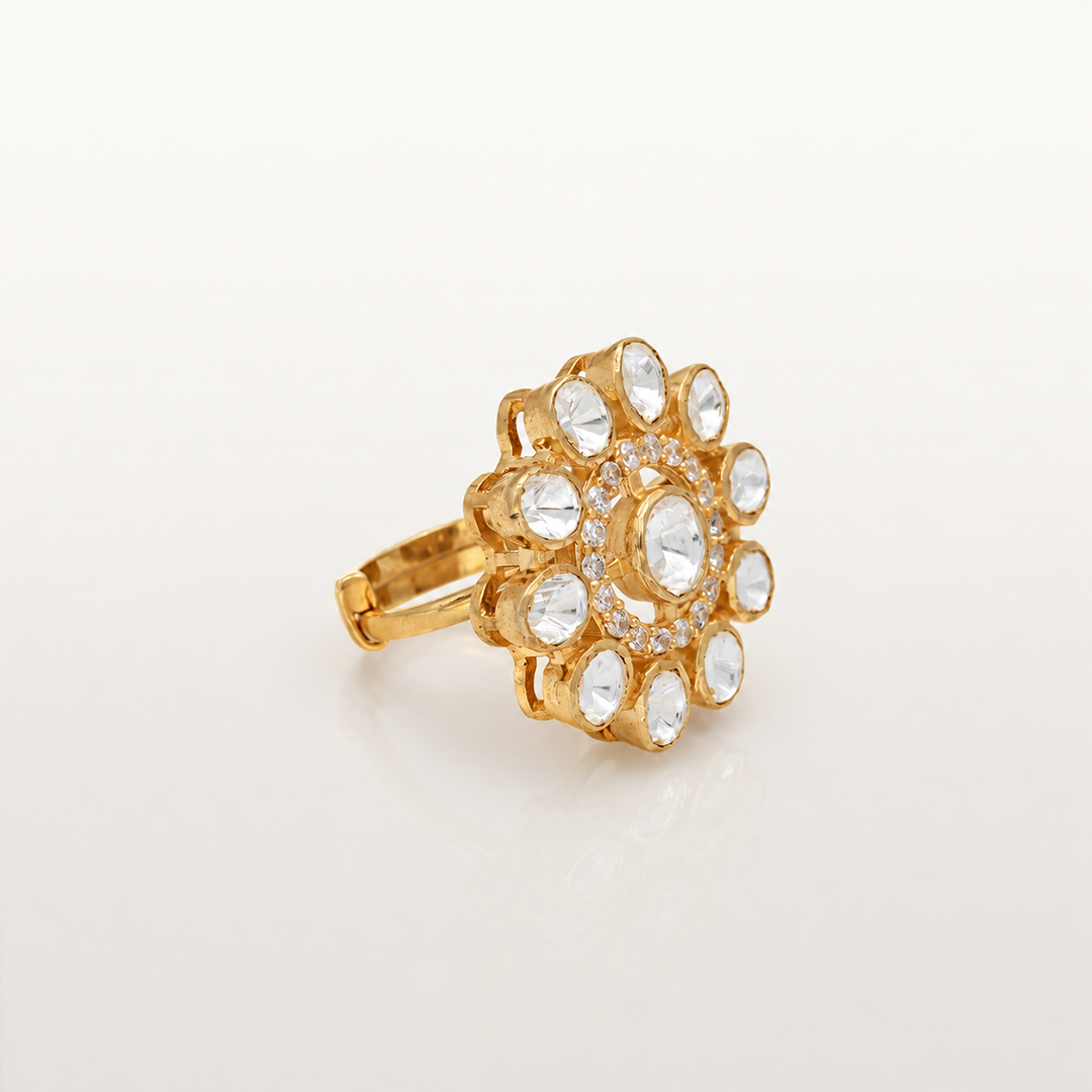 Angled view of gold-finish floral ring with white stones