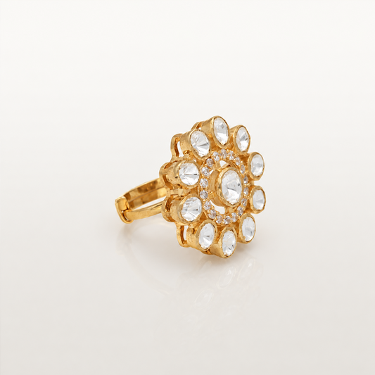 Angled view of gold-finish floral ring with white stones