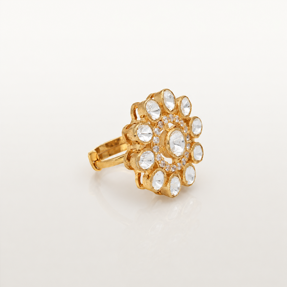 Angled view of gold-finish floral ring with white stones