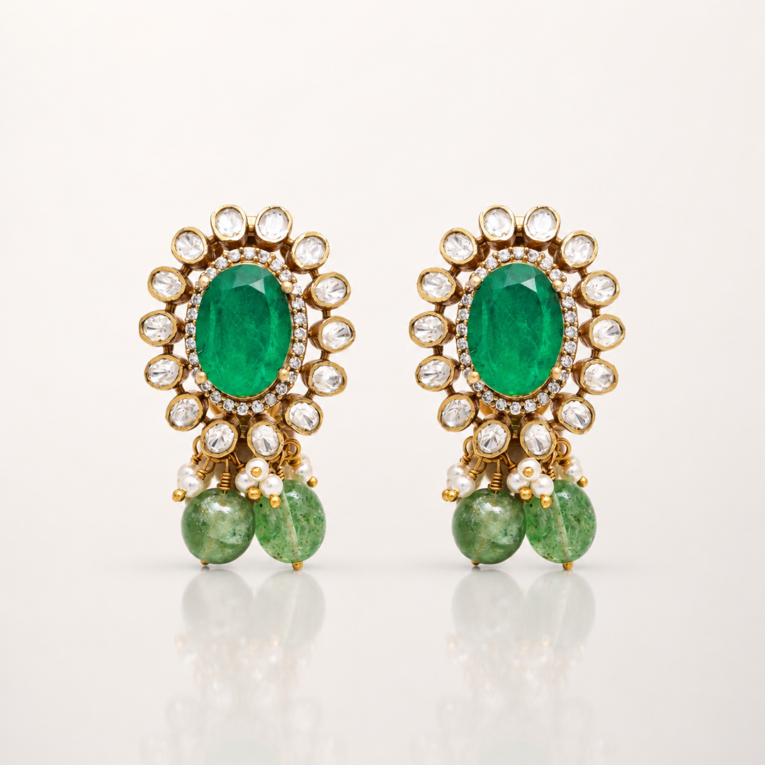 Gold-toned green gemstone drop earrings with clear stone halo