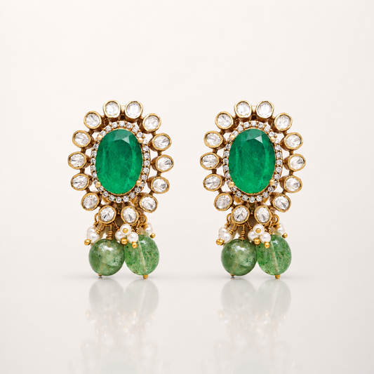 Gold-toned green gemstone drop earrings with clear stone halo