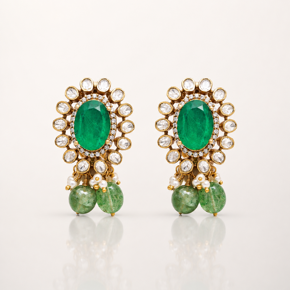 Gold-toned green gemstone drop earrings with clear stone halo