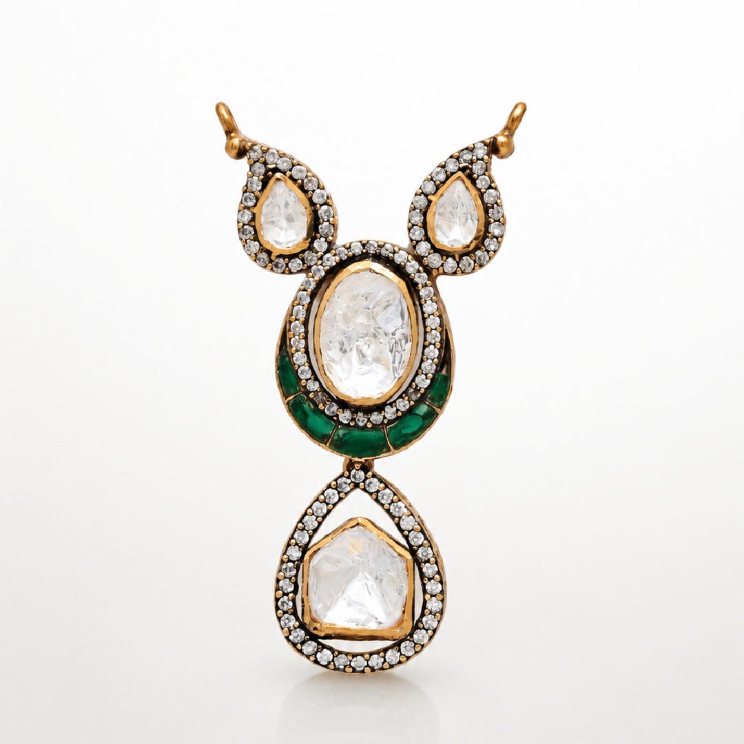 Haritara gold-toned pendant with layered teardrop design and green accents
