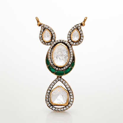 Haritara gold-toned pendant with layered teardrop design and green accents