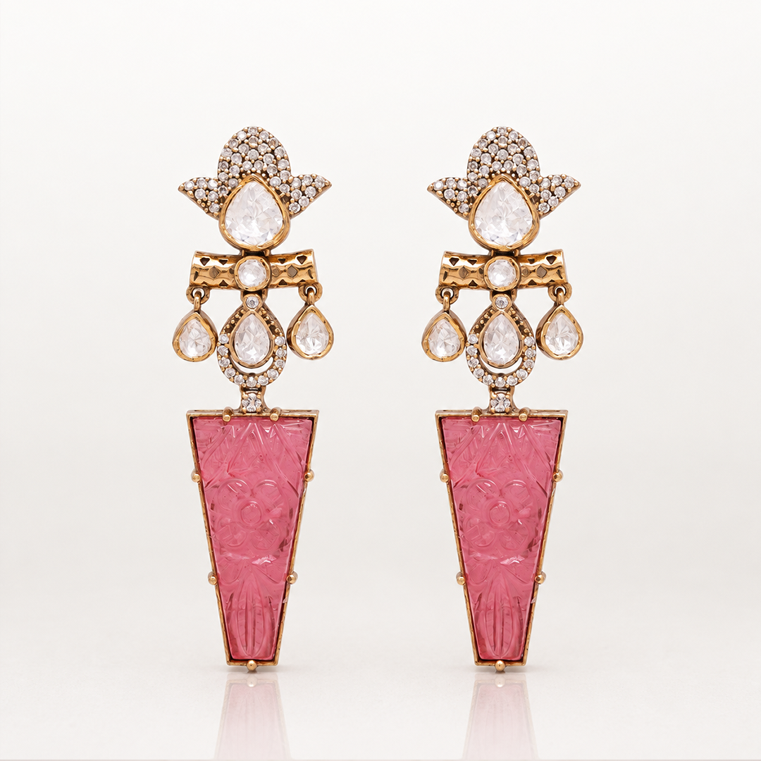 Iravati gold tone statement earrings with carved pink gemstone drops