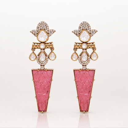 Iravati gold tone statement earrings with carved pink gemstone drops