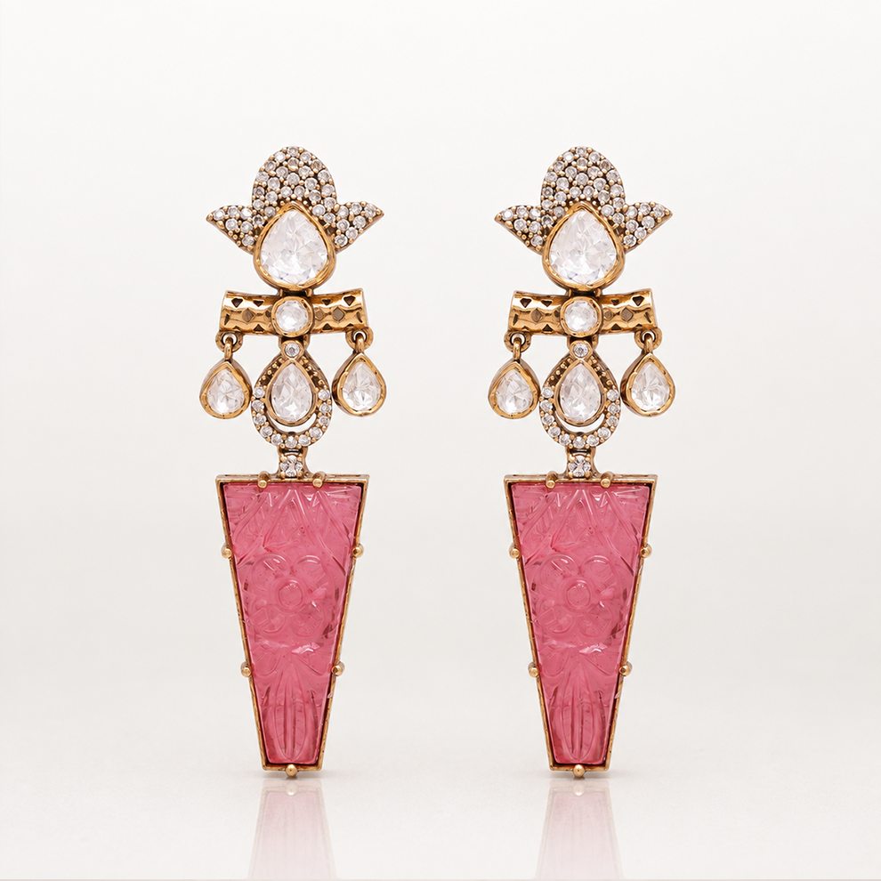 Iravati gold tone statement earrings with carved pink gemstone drops