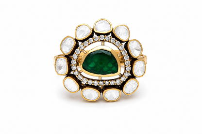 Gold-plated 925 sterling silver statement ring with pear-shaped emerald centre, Polki stones and zircon halo in traditional Indian floral design.