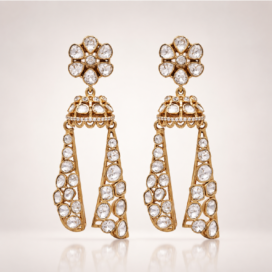 Gold-toned jhumka earrings with long stone-encrusted drops