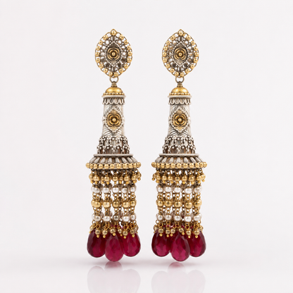 Long heritage earrings with red stone drops, pearls and intricate gold silver detailing
