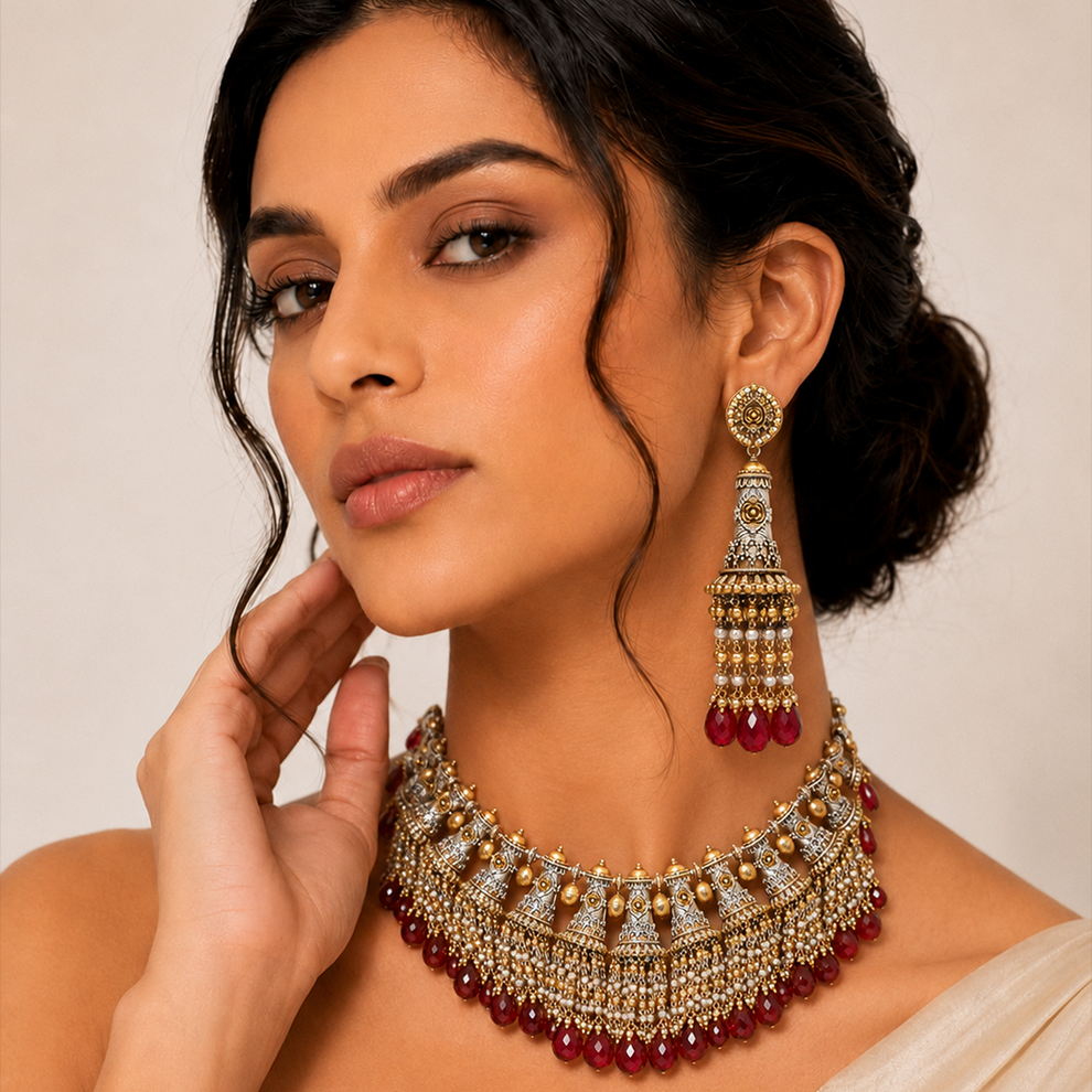 Traditional Indian necklace set with cascading red stone and pearl embellishments