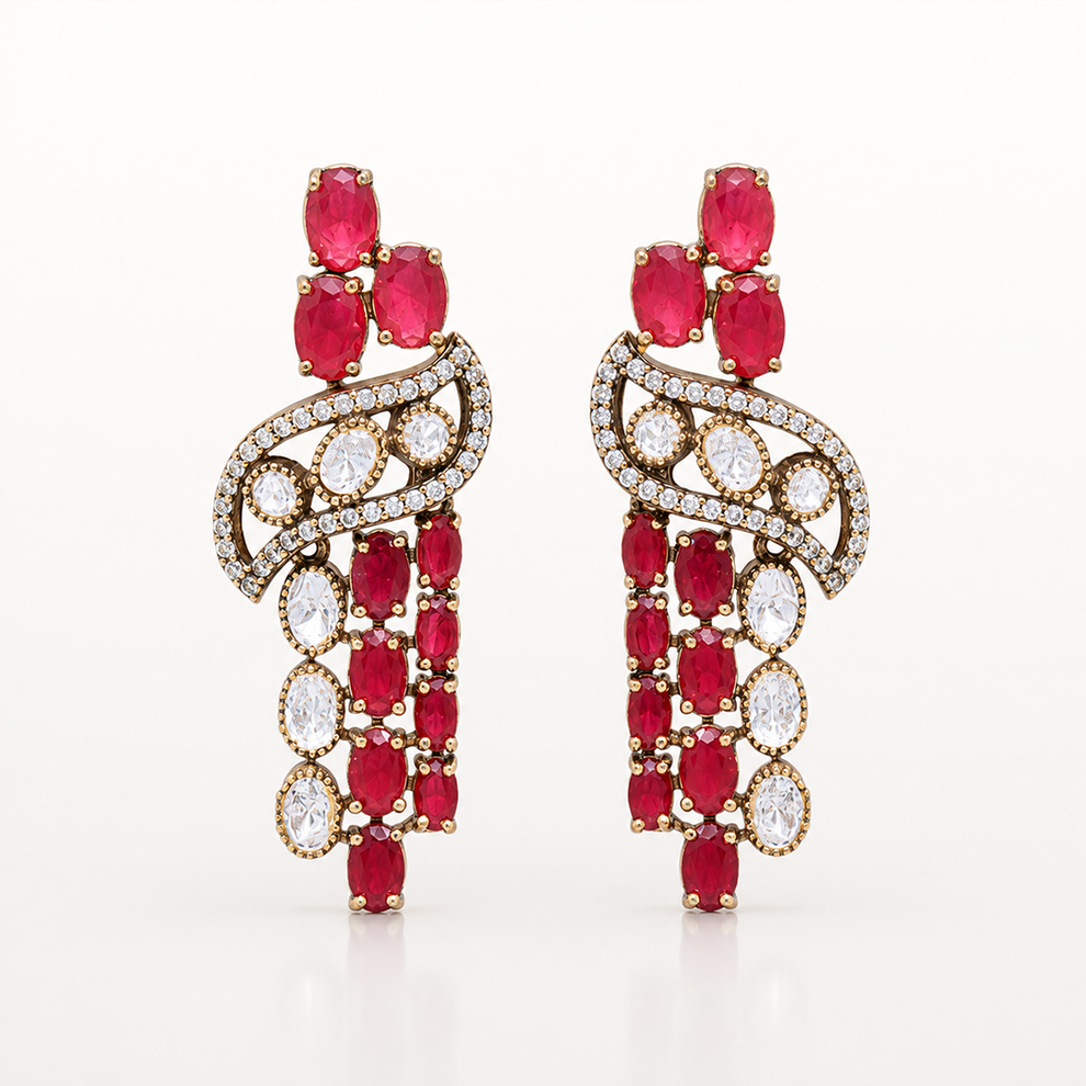 Rangdhara matching earrings with red gemstones and white stone detailing