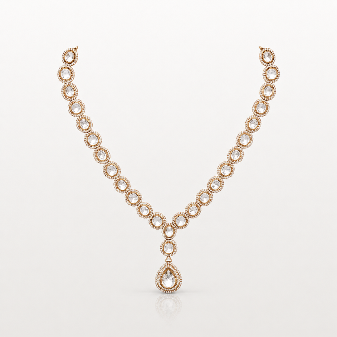 Gold-toned teardrop pendant necklace with clear oval stones