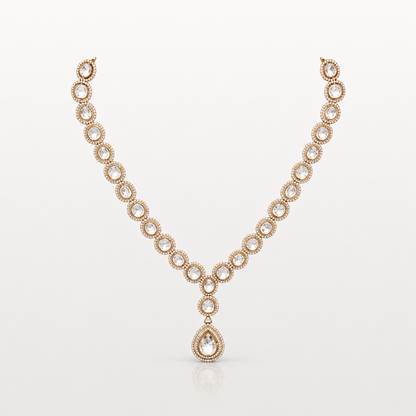 Gold-toned teardrop pendant necklace with clear oval stones