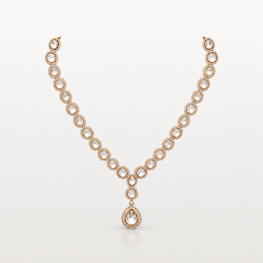 Gold-toned teardrop pendant necklace with clear oval stones