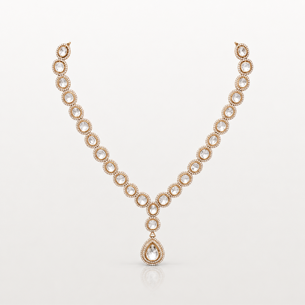 Gold-toned teardrop pendant necklace with clear oval stones