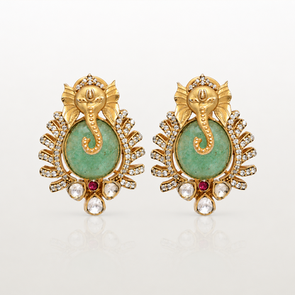 Varnika Ganesha earrings with green coloured stone and clear stone detailing