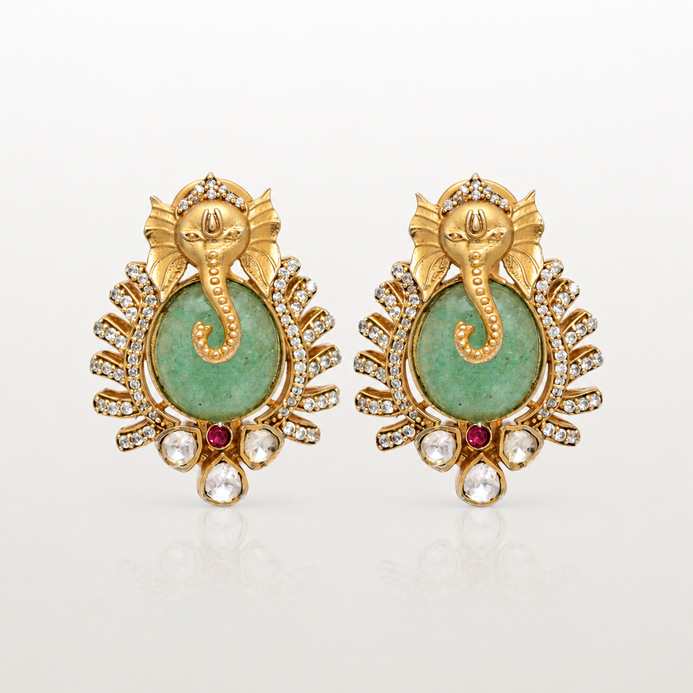 Varnika Ganesha earrings with green coloured stone and clear stone detailing
